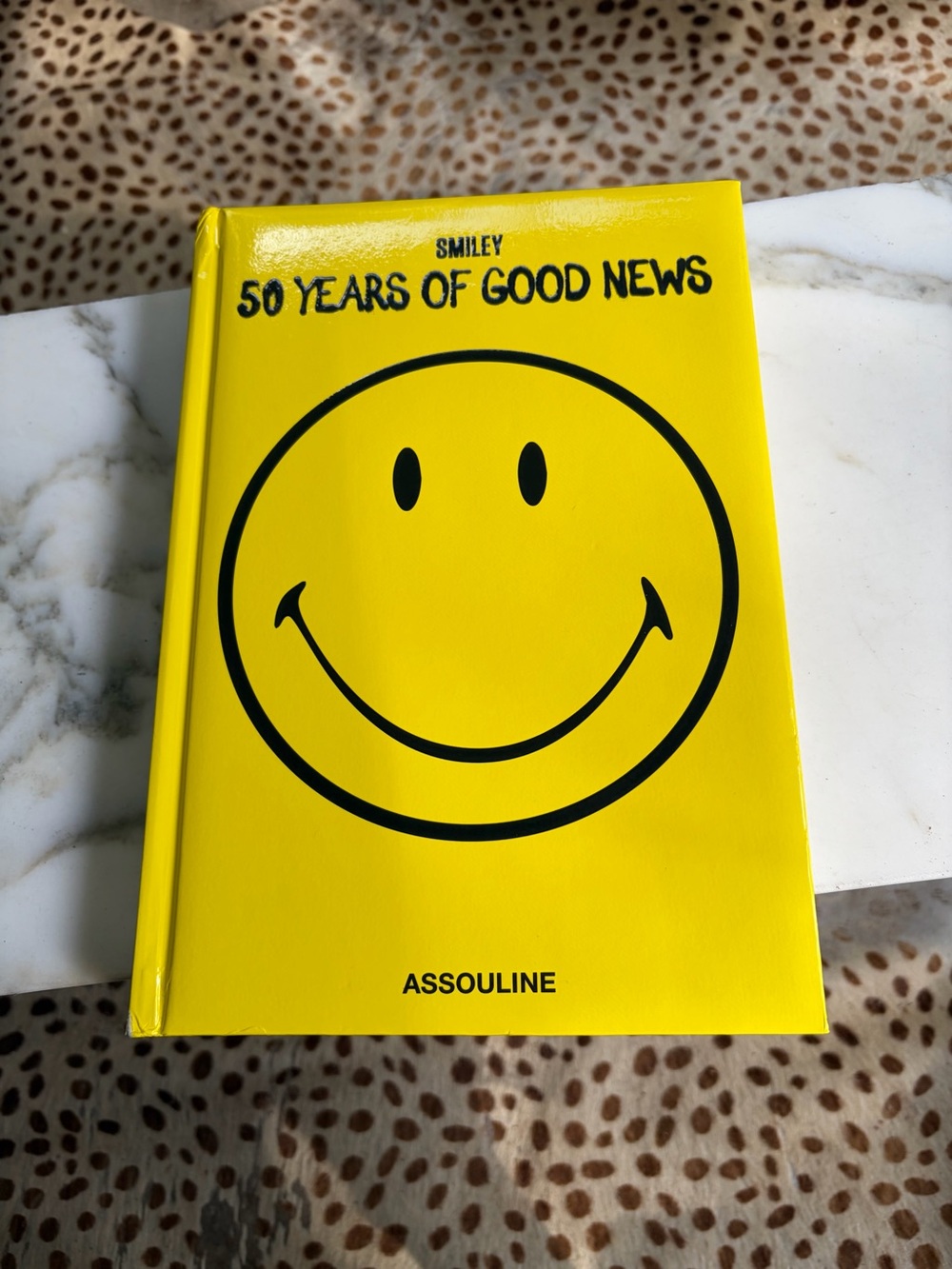 Assouline Smiley "50 Years of Good News" Yellow Coffee Table Book